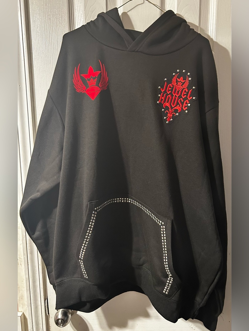Jewel House Black Crewneck Sweatshirt with Red Crest Accents